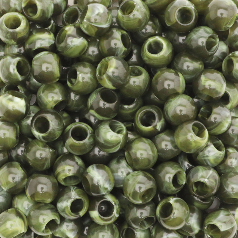 Close-up of green beads with a marbled pattern