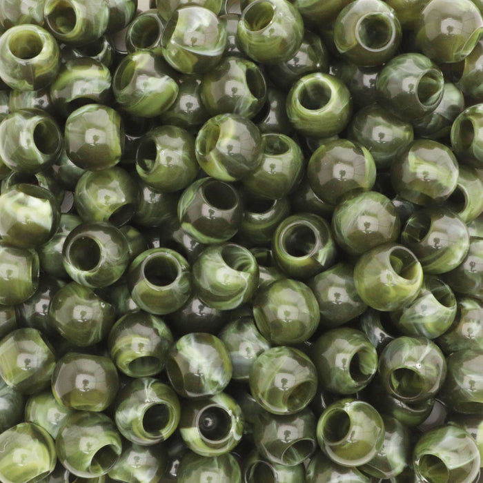 Close-up of green beads with a marbled pattern