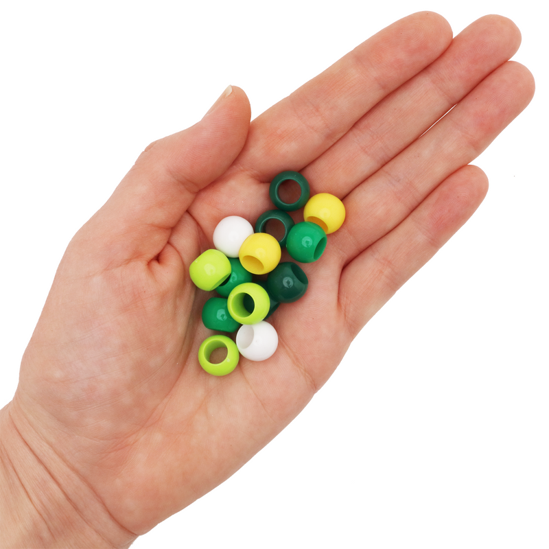 Large Hole Acrylic Beads in Dark Green Light Green Yellow and White Colors in a hand on a white background
