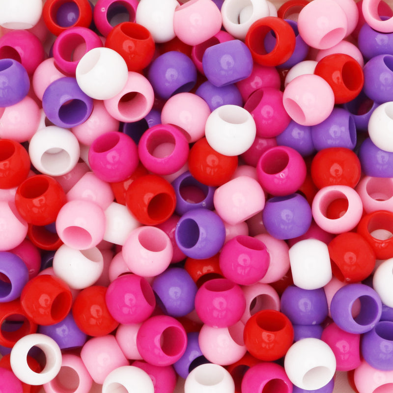 Assorted large hole acrylic beads in red and pink colors